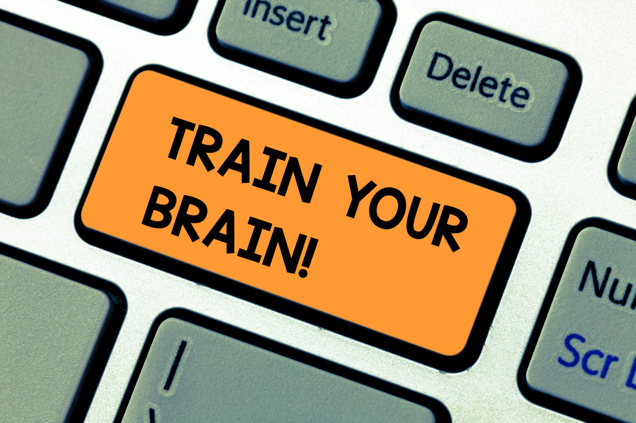 Graphic of a keyboard button that says train your brain!